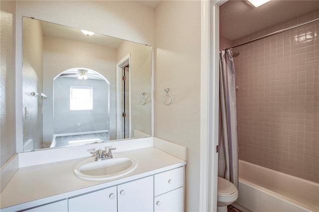 3800 Decomine Dr, Chalmette, LA 70043 - bathroom with a textured wall, toilet, vanity, and shower / bath combo with shower curtain