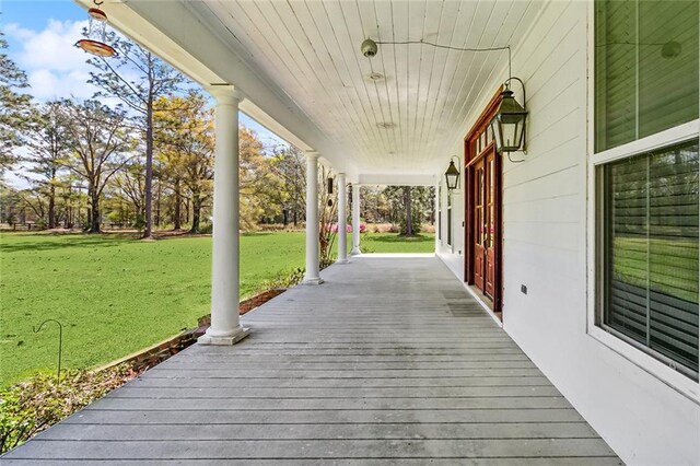 80055 Rollo Rd, Bush, LA 70431 - deck featuring a lawn and covered porch