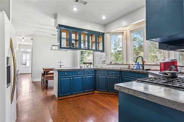 80055 Rollo Rd, Bush, LA 70431 - kitchen featuring a sink, blue cabinets, dark countertops, and dark wood-type flooring