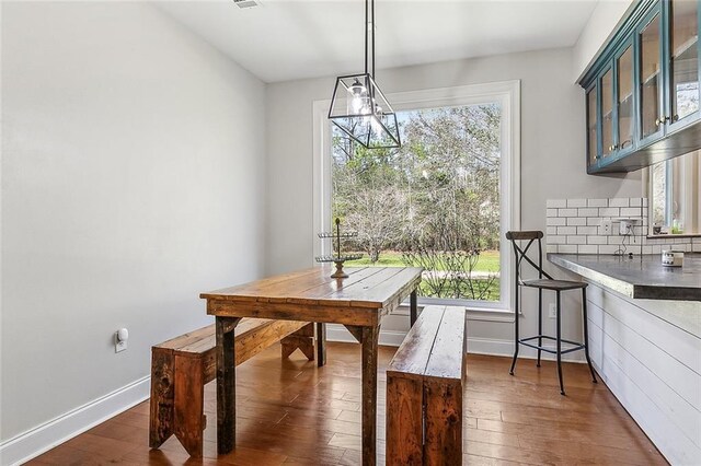 80055 Rollo Rd, Bush, LA 70431 - dining room with dark wood-style floors, visible vents, and baseboards