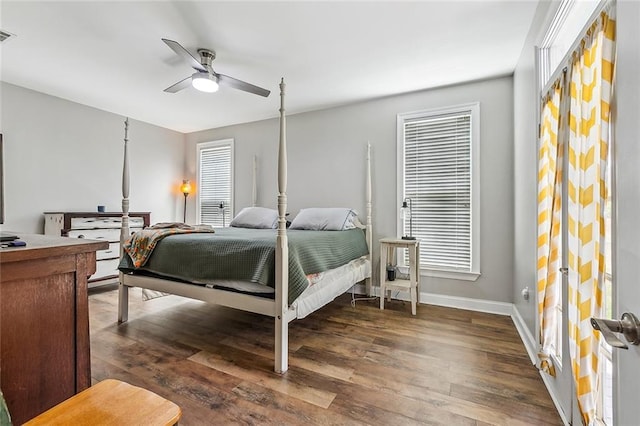 80055 Rollo Rd, Bush, LA 70431 - bedroom featuring baseboards, wood finished floors, multiple windows, and a ceiling fan