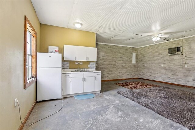 80055 Rollo Rd, Bush, LA 70431 - kitchen featuring light countertops, a sink, unfinished concrete floors, ceiling fan, and freestanding refrigerator
