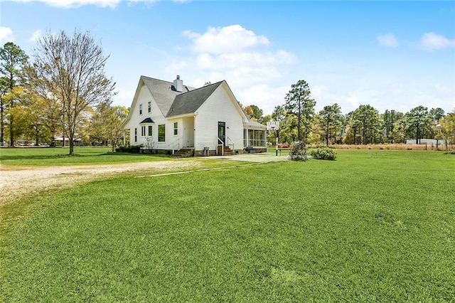 80055 Rollo Rd, Bush, LA 70431 - view of side of home featuring a chimney and a lawn