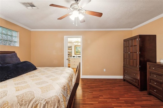 bedroom featuring dark wood finished floors, a textured ceiling, ornamental molding, visible vents, and baseboards