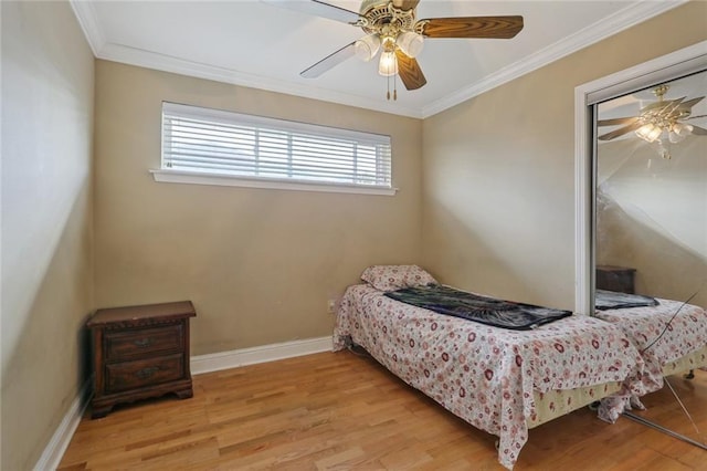 4529 Citrus Dr, New Orleans, LA 70127 - bedroom with crown molding, wood finished floors, baseboards, and a ceiling fan