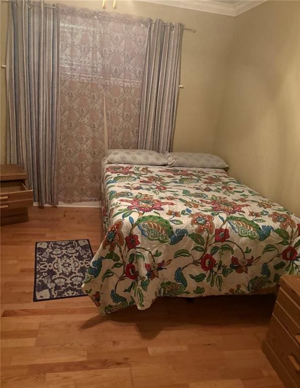 4529 Citrus Dr, New Orleans, LA 70127 - bedroom featuring crown molding and wood finished floors