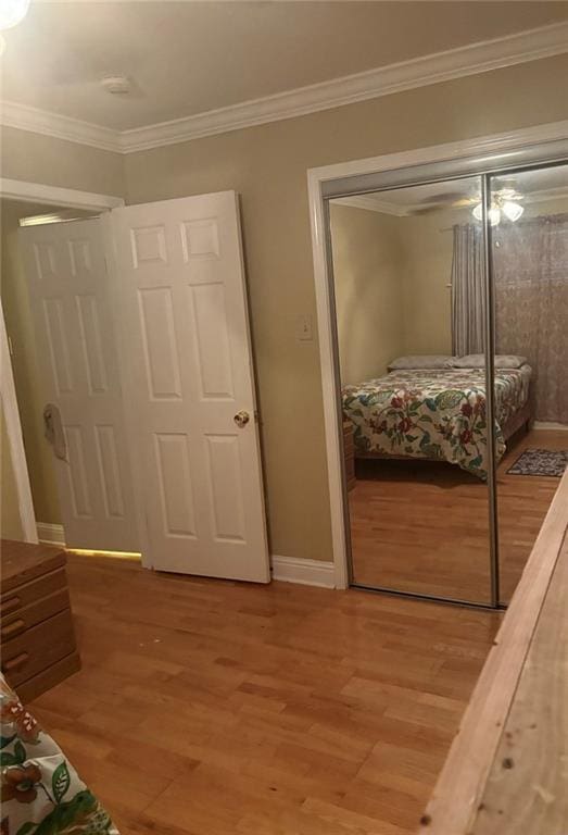 4529 Citrus Dr, New Orleans, LA 70127 - unfurnished bedroom with light wood-style flooring, a closet, and ornamental molding
