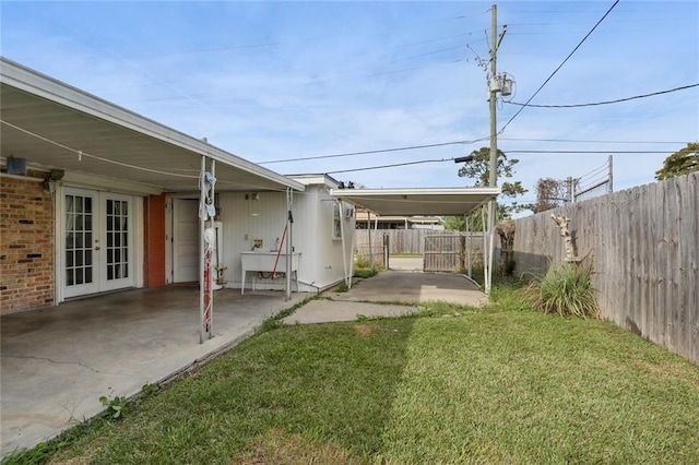 4529 Citrus Dr, New Orleans, LA 70127 - view of yard featuring french doors and fence