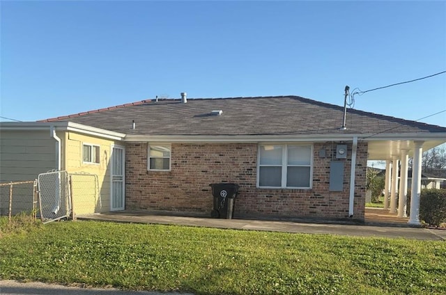 4529 Citrus Dr, New Orleans, LA 70127 - back of property with a yard, a patio area, fence, and brick siding