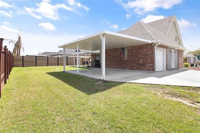view of property exterior with fence, brick siding, a shingled roof, a garage, and a yard