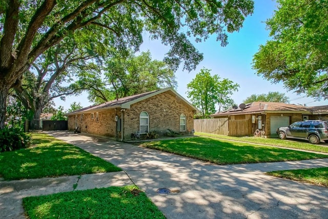 7984 Edgelake Ct, New Orleans, LA 70126 - view of side of property featuring brick siding, fence, and a lawn