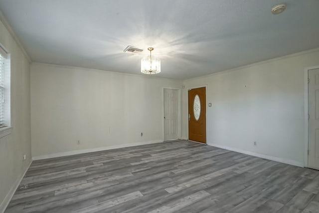 7984 Edgelake Ct, New Orleans, LA 70126 - interior space with a notable chandelier, baseboards, crown molding, and wood finished floors