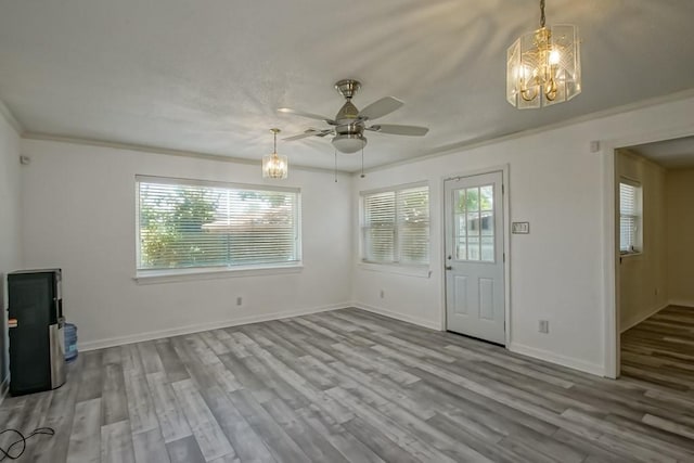 7984 Edgelake Ct, New Orleans, LA 70126 - interior space featuring ornamental molding, baseboards, wood finished floors, and ceiling fan with notable chandelier