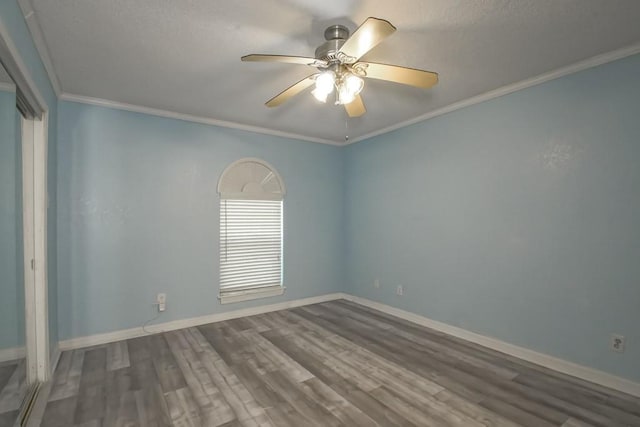 7984 Edgelake Ct, New Orleans, LA 70126 - empty room featuring crown molding, wood finished floors, ceiling fan, and baseboards
