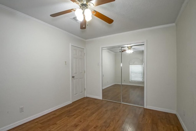 7984 Edgelake Ct, New Orleans, LA 70126 - unfurnished bedroom featuring visible vents, a closet, baseboards, and wood finished floors