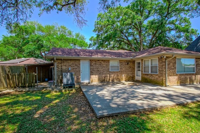 7984 Edgelake Ct, New Orleans, LA 70126 - back of house with a patio area, fence, brick siding, and a yard