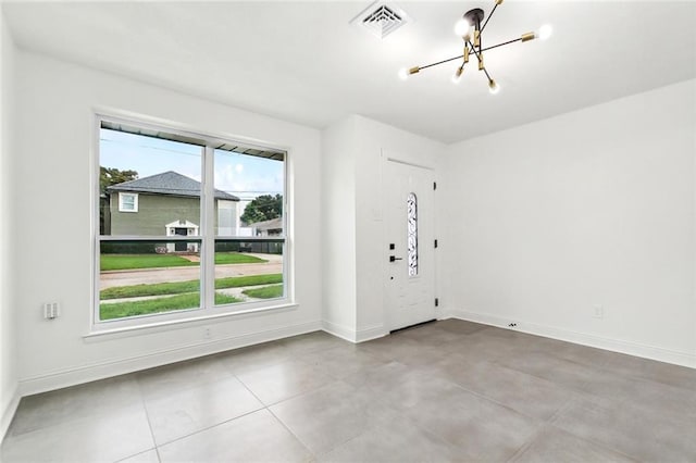 4904 Argonne St, Metairie, LA 70001 - spare room featuring a chandelier and baseboards