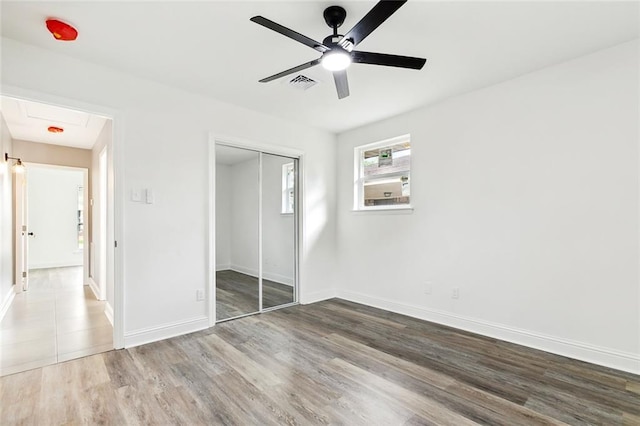 4904 Argonne St, Metairie, LA 70001 - unfurnished bedroom featuring wood finished floors, a closet, baseboards, and ceiling fan