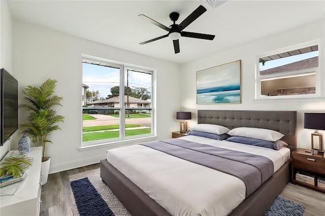 4904 Argonne St, Metairie, LA 70001 - bedroom with wood finished floors, baseboards, and ceiling fan