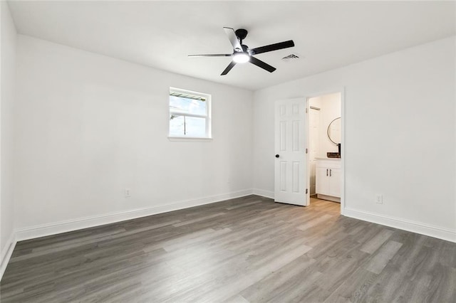 4904 Argonne St, Metairie, LA 70001 - unfurnished bedroom featuring wood finished floors, baseboards, ceiling fan, and ensuite bathroom
