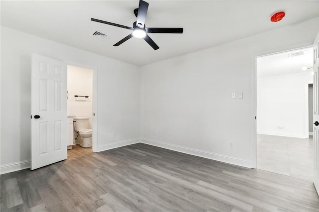 4904 Argonne St, Metairie, LA 70001 - unfurnished bedroom featuring wood finished floors, baseboards, ensuite bath, and a ceiling fan
