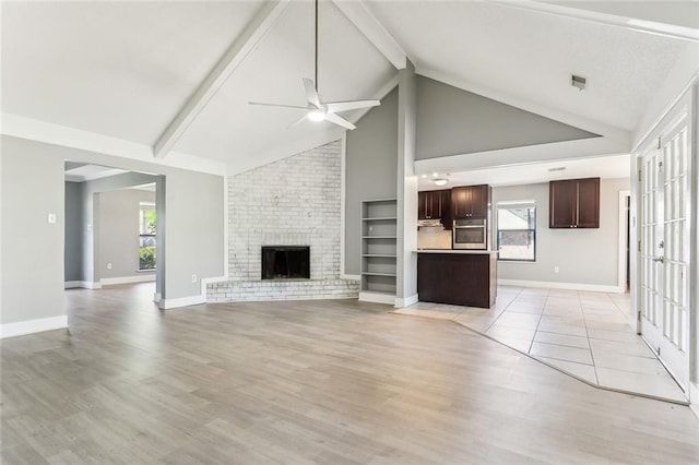 238 Blue Crane 1 Dr, Slidell, LA 70461 - unfurnished living room with baseboards, beam ceiling, light wood-style floors, visible vents, and ceiling fan