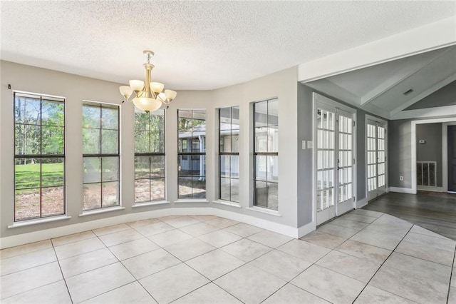 238 Blue Crane 1 Dr, Slidell, LA 70461 - unfurnished dining area with light tile patterned flooring, baseboards, and a notable chandelier