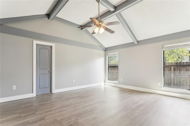 238 Blue Crane 1 Dr, Slidell, LA 70461 - empty room with wood finished floors, vaulted ceiling with beams, baseboards, and ceiling fan