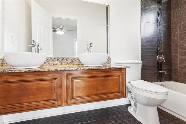 6309 Debore Dr, New Orleans, LA 70126 - bathroom with double vanity, a sink, toilet, and washtub / shower combination