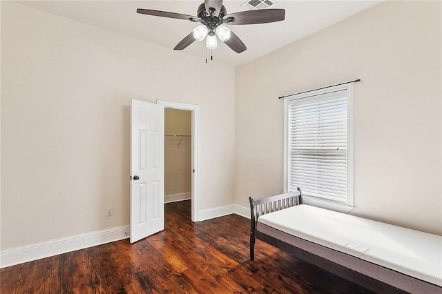6309 Debore Dr, New Orleans, LA 70126 - bedroom featuring a closet, visible vents, baseboards, wood finished floors, and a spacious closet