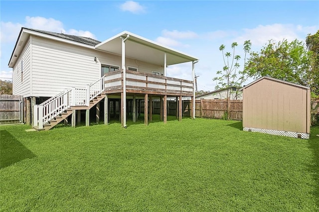6309 Debore Dr, New Orleans, LA 70126 - back of house featuring a storage shed, a fenced backyard, stairway, a lawn, and an outbuilding