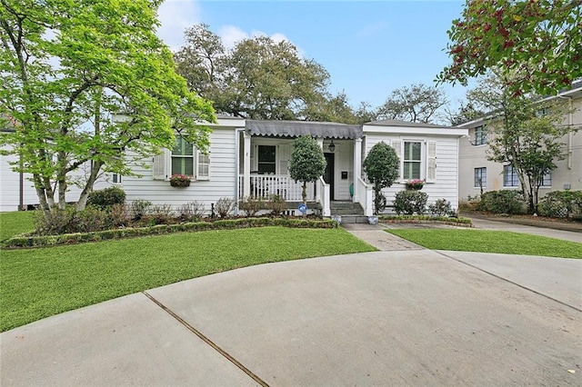 107 Stella St, Metairie, LA 70005 - view of front facade featuring a front yard and a porch