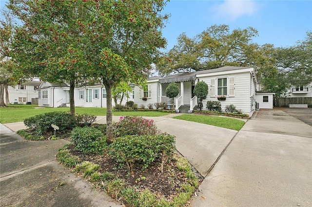 107 Stella St, Metairie, LA 70005 - view of front of property with a front lawn and concrete driveway