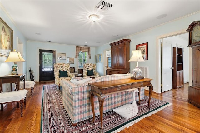 107 Stella St, Metairie, LA 70005 - living area with light wood finished floors and ornamental molding