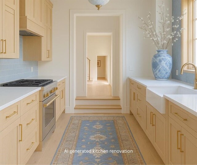 107 Stella St, Metairie, LA 70005 - kitchen with stainless steel range, a sink, backsplash, light countertops, and light wood-type flooring