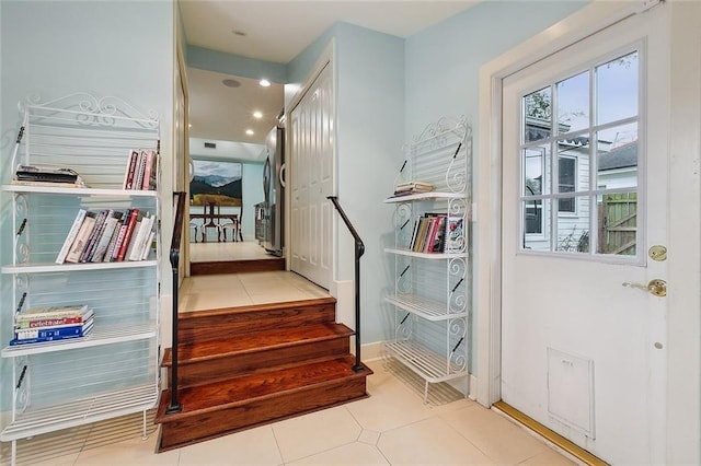 107 Stella St, Metairie, LA 70005 - stairway featuring healthy amount of natural light and tile patterned floors
