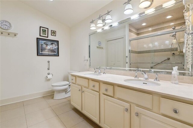 107 Stella St, Metairie, LA 70005 - bathroom with a stall shower, tile patterned flooring, double vanity, toilet, and baseboards