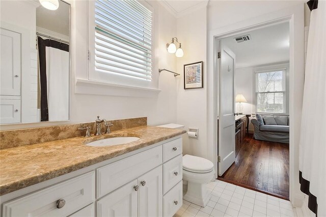 107 Stella St, Metairie, LA 70005 - full bath with tile patterned floors, vanity, ornamental molding, and toilet