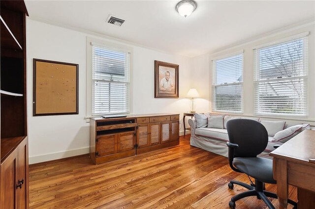 107 Stella St, Metairie, LA 70005 - home office with light wood finished floors and baseboards