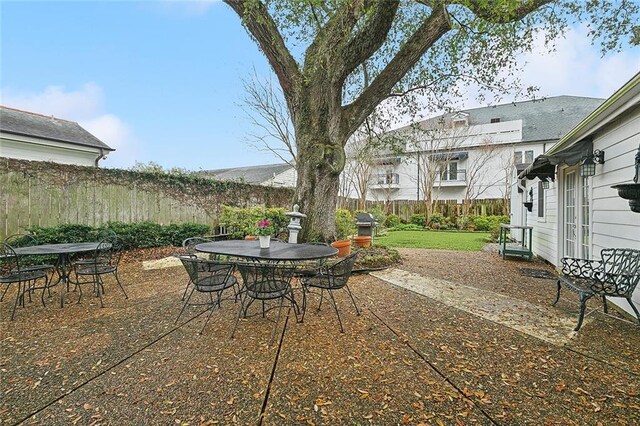 107 Stella St, Metairie, LA 70005 - view of patio featuring outdoor dining area and a fenced backyard