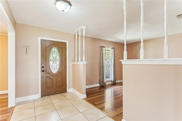 803 Lake Dcote Ct, Slidell, LA 70461 - tiled entryway with a textured ceiling and baseboards