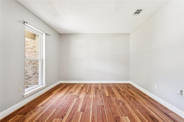 803 Lake Dcote Ct, Slidell, LA 70461 - unfurnished room featuring wood finished floors and a textured ceiling