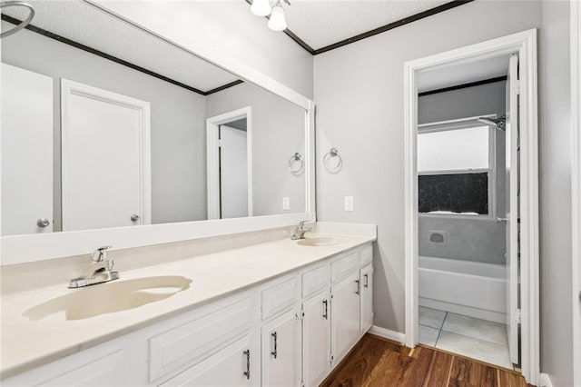 803 Lake Dcote Ct, Slidell, LA 70461 - full bath featuring double vanity, wood finished floors, a tub, and ornamental molding