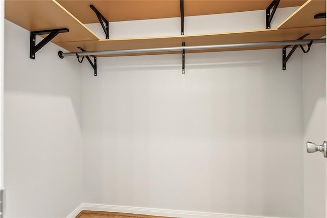 803 Lake Dcote Ct, Slidell, LA 70461 - walk in closet with wood finished floors