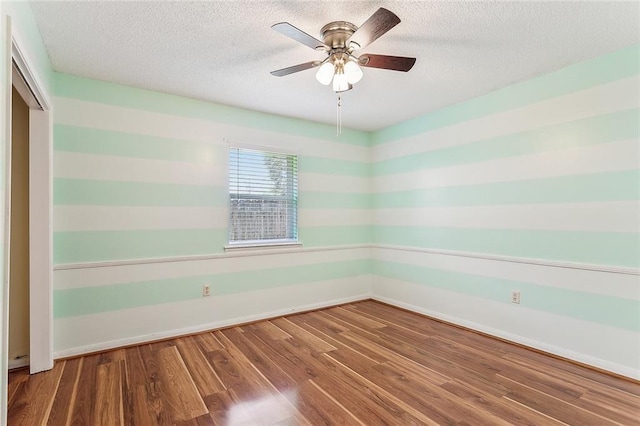 803 Lake Dcote Ct, Slidell, LA 70461 - unfurnished room with a textured ceiling, wood finished floors, baseboards, and ceiling fan