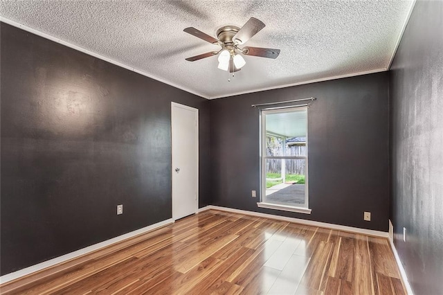 803 Lake Dcote Ct, Slidell, LA 70461 - spare room featuring wood finished floors, a textured ceiling, ceiling fan, and baseboards