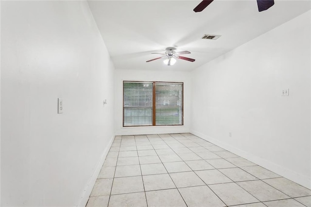 1465 Sunset Dr, Slidell, LA 70460 - spare room featuring a ceiling fan, light tile patterned floors, and baseboards