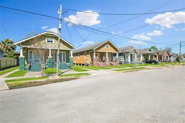 view of front of property with covered porch and a residential view