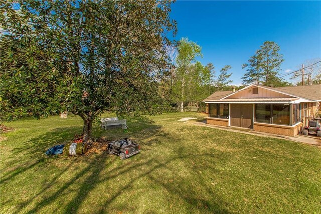17168 E Little Italy Rd, Hammond, LA 70403 - view of yard featuring a sunroom