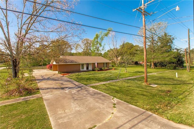 17168 E Little Italy Rd, Hammond, LA 70403 - view of front facade with driveway, stucco siding, and a front lawn